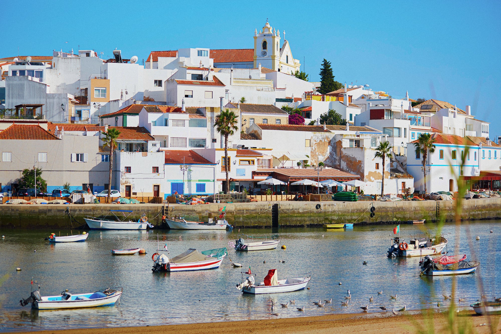 Scenic view of fishing boats in Ferragudo, Portugal